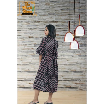 A model wearing Pure Cotton Black Printed One Piece Mid-length Dress For Women A model wearing Pure Cotton Black Printed One Piece Mid-length Dress For Women