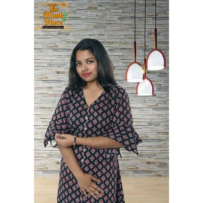 A model wearing Pure Cotton Black Printed One Piece Mid-length Dress For Women A model wearing Pure Cotton Black Printed One Piece Mid-length Dress For Women