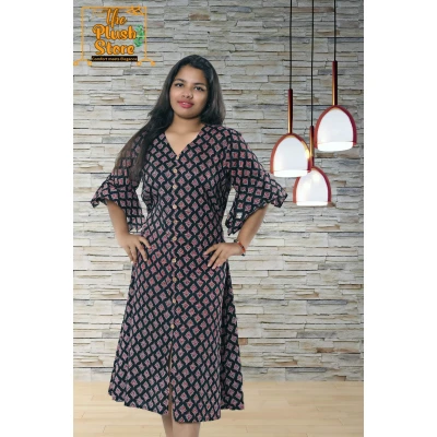 A model wearing Pure Cotton Black Printed One Piece Mid-length Dress For Women A model wearing Pure Cotton Black Printed One Piece Mid-length Dress For Women