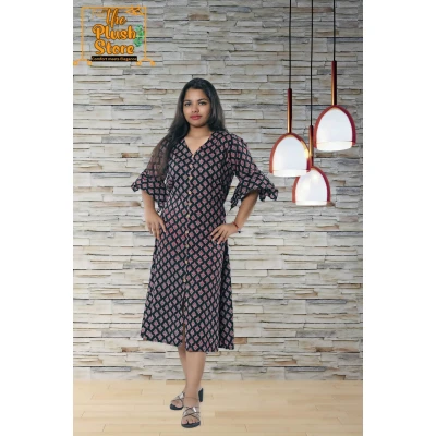 A model wearing Pure Cotton Black Printed One Piece Mid-length Dress For Women A model wearing Pure Cotton Black Printed One Piece Mid-length Dress For Women