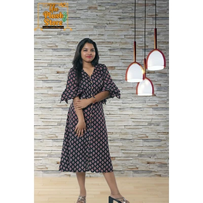 A model wearing Pure Cotton Black Printed One Piece Mid-length Dress For Women A model wearing Pure Cotton Black Printed One Piece Mid-length Dress For Women