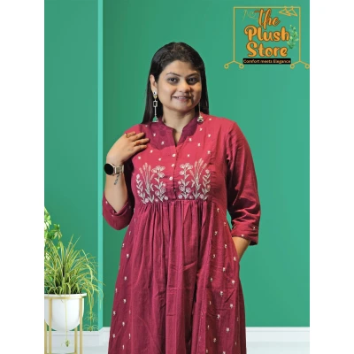 A model wearing Cotton-Linen 2 Piece Kurti Palazzo Set with Embroidery work For Women A model wearing Cotton-Linen 2 Piece Kurti Palazzo Set with Embroidery work For Women