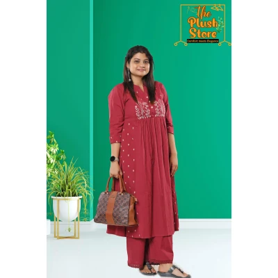 A model wearing Cotton-Linen 2 Piece Kurti Palazzo Set with Embroidery work For Women A model wearing Cotton-Linen 2 Piece Kurti Palazzo Set with Embroidery work For Women