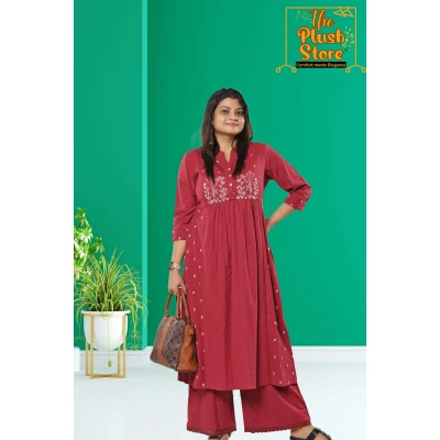 A model wearing Cotton-Linen 2 Piece Kurti Palazzo Set with Embroidery work For Women A model wearing Cotton-Linen 2 Piece Kurti Palazzo Set with Embroidery work For Women