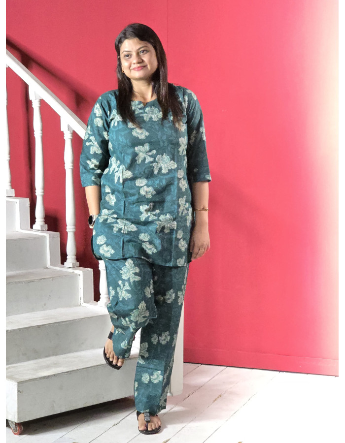 A model wearing Pure Cotton Printed Co-ord Set For Women in green colour A model wearing Pure Cotton Printed Co-ord Set For Women in green colour