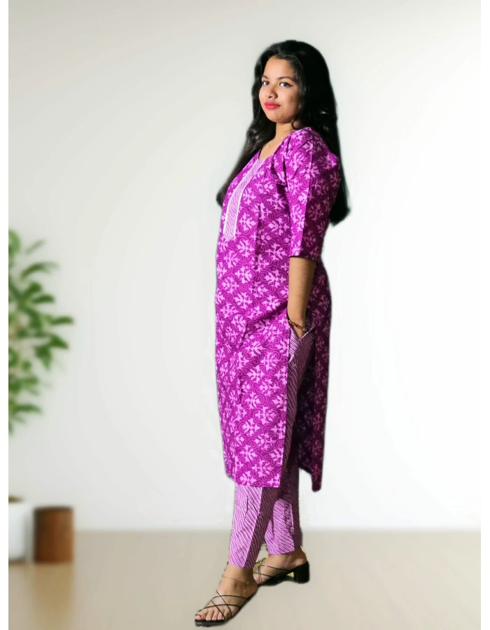 A model wearing Lavender Pure Cotton Kurti Straight Pant Set For Women A model wearing Lavender Pure Cotton Kurti Straight Pant Set For Women