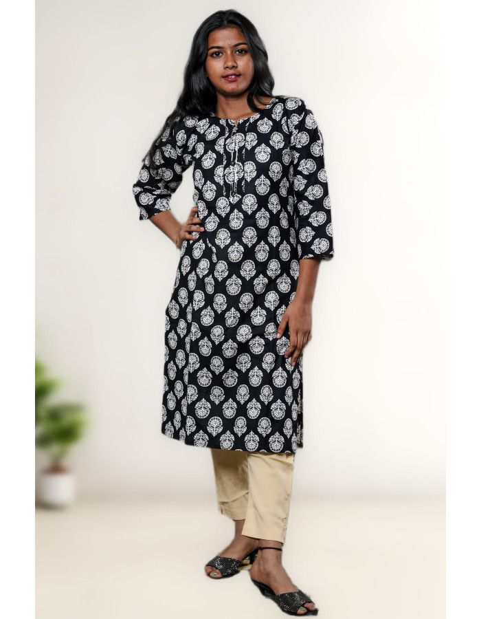 A model wearing Pure Cotton Black Printed Kurti For Women in black colour A model wearing Pure Cotton Black Printed Kurti For Women in black colour